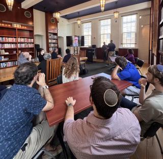 Paul Scham farewell with students, faculty, staff & community